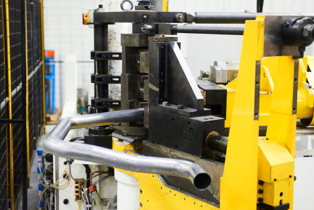 Pipe bender machine forming a steel tube at Langbow, UK tube bending machinery specialists