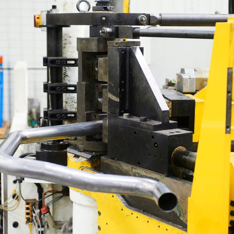 Pipe bender machine forming a steel tube at Langbow, UK tube bending machinery specialists